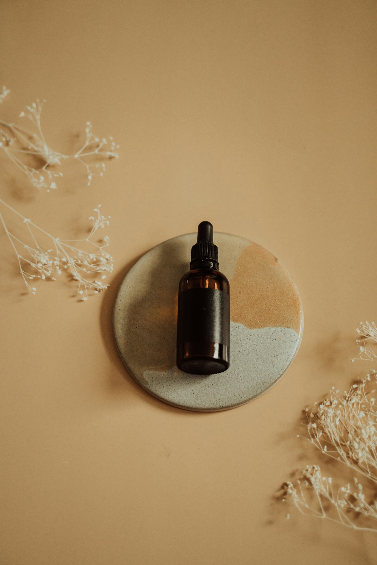 Brand concept and product sample photography laid out on a warm neutral background